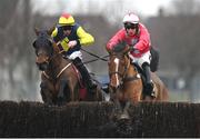 12 January 2024; Pats Choice, left, with Jack Kennedy up, jumps the last on their way to winning the Race And Stay Handicap Steeplechase, alongside eventual third place Union Park, right, with James O'Sullivan up, at Naas Racecourse in Kildare. Photo by Seb Daly/Sportsfile