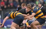 11 January 2024; James Dreyer of The High School is tackled by Harry Quinn, left, and Oliver Galván Hogan of The King’s Hospital during the Bank of Ireland Fr Godfrey Cup Round 1 match between The King's Hospital and The High School at Energia Park in Dublin. Photo by Seb Daly/Sportsfile