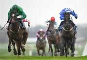 12 January 2024; Readin Tommy Wrong, left, with Daryl Jacob up, on their way to winning the Lawlor's Of Naas Novice Hurdle, from second place Ile Atlantique, right, with Paul Townend up, at Naas Racecourse in Kildare. Photo by Seb Daly/Sportsfile