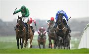 12 January 2024; Readin Tommy Wrong, left, with Daryl Jacob up, on their way to winning the Lawlor's Of Naas Novice Hurdle, from second place Ile Atlantique, right, with Paul Townend up, at Naas Racecourse in Kildare. Photo by Seb Daly/Sportsfile