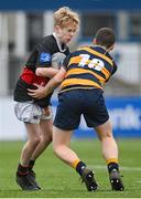 11 January 2024; Ethan Jackson of The High School is tackled by Dylan Smyth of The King’s Hospital during the Bank of Ireland Fr Godfrey Cup Round 1 match between The King's Hospital and The High School at Energia Park in Dublin. Photo by Seb Daly/Sportsfile