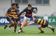 11 January 2024; Aran Loftus of The High School evades the tackle of Dylan Smyth of The King’s Hospital during the Bank of Ireland Fr Godfrey Cup Round 1 match between The King's Hospital and The High School at Energia Park in Dublin. Photo by Seb Daly/Sportsfile