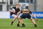 11 January 2024; Ethan Jackson of The High School in action against Dylan Smyth of The King’s Hospital during the Bank of Ireland Fr Godfrey Cup Round 1 match between The King's Hospital and The High School at Energia Park in Dublin. Photo by Seb Daly/Sportsfile