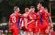 12 January 2024; Keith Ward of Shelbourne, left, celebrates with teammates, including Shane Griffin, right, after scoring their side's first goal during the pre-season friendly match between Shelbourne and Dundalk at AUL Complex in Clonsaugh, Dublin. Photo by Ben McShane/Sportsfile