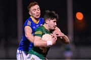12 January 2024; Diarmuid Moriarty of Meath is tackled by Ryan Moffett of Longford during the O'Byrne Cup Semi-Final match between Meath and Longford at Donaghmore Ashbourne GAA Club in Ashbourne, Meath. Photo by Ramsey Cardy/Sportsfile
