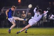 12 January 2024; Jayson Matthews of Longford scores a point past Meath goalkeeper Harry Hogan during the O'Byrne Cup Semi-Final match between Meath and Longford at Donaghmore Ashbourne GAA Club in Ashbourne, Meath. Photo by Ramsey Cardy/Sportsfile