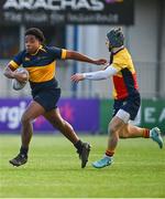 9 January 2024; Keith Johnson of The King's Hospital in action against Giovanni Nostro of St Fintan's during the Bank of Ireland Vinnie Murray Cup Round 1 match between The High School and St Andrews College at Energia Park in Dublin. Photo by Tyler Miller/Sportsfile