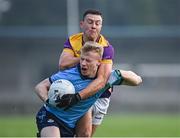 13 January 2024; Eoin O'Dea of Dublin is fouled by Eoghan Nolan of Wexford during the O'Byrne Cup semi-final match between Dublin and Wexford at Parnell Park in Dublin. Photo by Stephen Marken/Sportsfile
