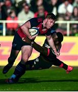 13 January 2024; Jack Crowley of Munster is tackled by Dany Priso of Toulon during the Investec Champions Cup Pool 3 Round 3 match between RC Toulon and Munster at Stade Felix Mayol in Toulon, France. Photo by Eóin Noonan/Sportsfile