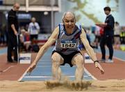 13 January 2024; Peadar McGing of Dundrum South Dublin AC, Dublin, competes in the men's over 65 Triple Jump during the 123.ie National Masters Indoor Championships at the TUS International arena in Athlone, Westmeath. Photo by Tyler Miller/Sportsfile