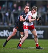 13 January 2024; Brendan Rogers of Derry in action against Niall Rowland of Armagh during the Bank of Ireland Dr McKenna Cup semi-final match between Armagh and Derry at BOX-IT Athletic Grounds in Armagh. Photo by Ben McShane/Sportsfile