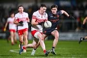 13 January 2024; Gareth McKinless of Derry in action against Sean Conlon of Armagh during the Bank of Ireland Dr McKenna Cup semi-final match between Armagh and Derry at BOX-IT Athletic Grounds in Armagh. Photo by Ben McShane/Sportsfile