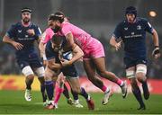 13 January 2024; Garry Ringrose of Leinster is tackled by Peniasi Dakuwaqa of Stade Francais during the Investec Champions Cup Pool 4 Round 3 match between Leinster and Stade Francais at the Aviva Stadium in Dublin. Photo by Harry Murphy/Sportsfile
