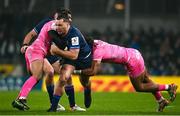 13 January 2024; James Lowe of Leinster is tackled by Stephane Ahmed and Peniasi Dakuwaqa of Stade Francais during the Investec Champions Cup Pool 4 Round 3 match between Leinster and Stade Francais at the Aviva Stadium in Dublin. Photo by Harry Murphy/Sportsfile