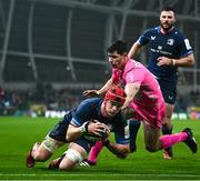 13 January 2024; Josh van der Flier of Leinster scores his side's second try despite the efforts of Leo Monin of Stade Francais during the Investec Champions Cup Pool 4 Round 3 match between Leinster and Stade Francais at the Aviva Stadium in Dublin. Photo by Sam Barnes/Sportsfile