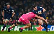 13 January 2024; Cian Healy of Leinster is tackled by JJ van der Mescht of Stade Francais during the Investec Champions Cup Pool 4 Round 3 match between Leinster and Stade Francais at the Aviva Stadium in Dublin. Photo by Seb Daly/Sportsfile
