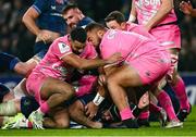 13 January 2024; Caelan Doris of Leinster dives over to score his side's sixth try despite the tackle of Zack Henry and Paul Alo-Emile of Stade Francais during the Investec Champions Cup Pool 4 Round 3 match between Leinster and Stade Francais at the Aviva Stadium in Dublin. Photo by Harry Murphy/Sportsfile