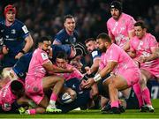 13 January 2024; Caelan Doris of Leinster dives over to score his side's sixth try despite the tackle of Zack Henry and Paul Alo-Emile of Stade Francais during the Investec Champions Cup Pool 4 Round 3 match between Leinster and Stade Francais at the Aviva Stadium in Dublin. Photo by Harry Murphy/Sportsfile