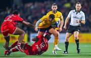 13 January 2024; Billy Burns of Ulster is tackled by Pita Ahki, 12, and Peato Mauvaka of Toulouse during the Investec Champions Cup Pool 2 Round 3 match between Ulster and Toulouse at Kingspan Stadium in Belfast. Photo by Ramsey Cardy/Sportsfile