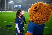 13 January 2024; Match day mascots Lauren Barrett, aged eight, and Mabel Keating, aged seven, meet Leo the Lion before the Investec Champions Cup Pool 4 Round 3 match between Leinster and Stade Francais at the Aviva Stadium in Dublin. Photo by Harry Murphy/Sportsfile