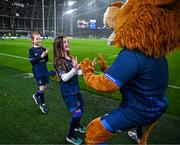 13 January 2024; Match day mascots Lauren Barrett, aged eight, and Mabel Keating, aged seven, meet Leo the Lion before the Investec Champions Cup Pool 4 Round 3 match between Leinster and Stade Francais at the Aviva Stadium in Dublin. Photo by Harry Murphy/Sportsfile