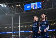 13 January 2024; Match day mascots Mabel Keating, aged seven, left, and Lauren Barrett, aged eight, spot themselves on the big screen before the Investec Champions Cup Pool 4 Round 3 match between Leinster and Stade Francais at the Aviva Stadium in Dublin. Photo by Harry Murphy/Sportsfile