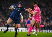 13 January 2024; Ryan Baird of Leinster is tackled by Leo Monin of Stade Francais during the Investec Champions Cup Pool 4 Round 3 match between Leinster and Stade Francais at the Aviva Stadium in Dublin. Photo by Harry Murphy/Sportsfile