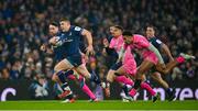 13 January 2024; Garry Ringrose of Leinster makes a break during the Investec Champions Cup Pool 4 Round 3 match between Leinster and Stade Francais at the Aviva Stadium in Dublin. Photo by Seb Daly/Sportsfile