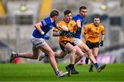 14 January 2024; Jack McElligott of Listowel Emmets is tackled by Thomas Partington, left, and Tristan Noack Hofmann of Arva during the AIB GAA Football All-Ireland Junior Club Championship final match between Arva of Cavan and Listowel Emmets of Kerry at Croke Park in Dublin. Photo by Ben McShane/Sportsfile