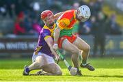 14 January 2024; Donagh Murphy of Carlow in action against Mike Kelly of Wexford during the Dioralyte Walsh Cup Round 3 match between Wexford and Carlow at Chadwicks Wexford Park in Wexford. Photo by Tyler Miller/Sportsfile
