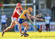 14 January 2024; Robin Mounsey of Clare in action against Ciarán Joyce of Cork during the Co-Op Superstores Munster Hurling League Group A match between Cork and Clare at Páirc Uí Rinn in Cork.  Photo by Eóin Noonan/Sportsfile
