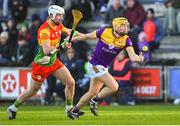 14 January 2024; Damien Reck of Wexford in action against Kevin McDonald of Carlow during the Dioralyte Walsh Cup Round 3 match between Wexford and Carlow at Chadwicks Wexford Park in Wexford. Photo by Tyler Miller/Sportsfile