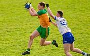 14 January 2024; Ciaran Thompson of Donegal in action against Darragh Treanor of Monaghan during the Dr McKenna Cup semi-final match between Monaghan and Donegal at Castleblayney in Monaghan. Photo by Ramsey Cardy/Sportsfile