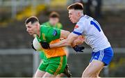 14 January 2024; Jamie Brennan of Donegal in action against Ciaran McNulty of Monaghan during the Dr McKenna Cup semi-final match between Monaghan and Donegal at Castleblayney in Monaghan. Photo by Ramsey Cardy/Sportsfile