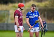 14 January 2024; Padraic Dunne of Laois inspects the hurley of Galway's TJ Brennan after the Dioralyte Walsh Cup Round 3 match between Galway and Laois at Duggan Park in Ballinasloe, Galway. Photo by Seb Daly/Sportsfile