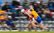 14 January 2024; Cormac Beausang of Cork is tackled by Seadna Morey of Clare during the Co-Op Superstores Munster Hurling League Group A match between Cork and Clare at Páirc Uí Rinn in Cork.  Photo by Eóin Noonan/Sportsfile