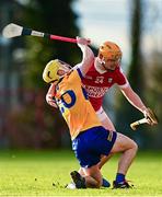14 January 2024; Paddy Donnellan of Clare is tackled by Darragh Flynn of Cork during the Co-Op Superstores Munster Hurling League Group A match between Cork and Clare at Páirc Uí Rinn in Cork.  Photo by Eóin Noonan/Sportsfile