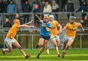 14 January 2024; Alex Considine of Dublin in action against Antrim players, from left, Conor Boyd, Rian McMullan and Ryan McCarry during the Dioralyte Walsh Cup Round 3 match between Dublin and Antrim at Parnell Park in Dublin. Photo by Sam Barnes/Sportsfile