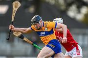14 January 2024; Conn Smyth of Clare in action against Robbie Cotter of Cork during the Co-Op Superstores Munster Hurling League Group A match between Cork and Clare at Páirc Uí Rinn in Cork.  Photo by Eóin Noonan/Sportsfile