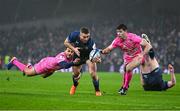 13 January 2024; Jordan Larmour of Leinster is tackled by Kylan Hamdaoui of Stade Francais and Leo Monin of Stade Francais during the Investec Champions Cup Pool 4 Round 3 match between Leinster and Stade Francais at the Aviva Stadium in Dublin. Photo by Sam Barnes/Sportsfile