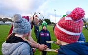 14 January 2024; Jason Flynn of Galway signs hurleys for supporters after the Dioralyte Walsh Cup Round 3 match between Galway and Laois at Duggan Park in Ballinasloe, Galway. Photo by Seb Daly/Sportsfile
