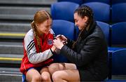 15 January 2024; Abbey Nealon, right, files the nails of Mungret Community College teammate Jennifer Keane before the Pinergy Basketball Ireland U16 A Girls Schools Cup Final match between Our Lady and St Patrick's College Knock, Belfast, and Mungret Community College, Limerick at the National Basketball Arena in Tallaght, Dublin. Photo by Ben McShane/Sportsfile