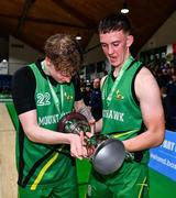 15 January 2024; Mercy Mounthawk captain Oisin McGibney, right, and Olaf Michalczuk look at the cup after the Pinergy Basketball Ireland U19 A Boys Schools Cup Final match between St Malachy’s College, Belfast, and Mercy Mounthawk, Tralee, Kerry at the National Basketball Arena in Tallaght, Dublin. Photo by Ben McShane/Sportsfile