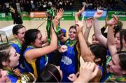 15 January 2024; St Mary's College Dundalk captain Elahna Faapito celebrates with the cup and her teammates after their victory in the Pinergy Basketball Ireland U19 B Girls Schools Cup Final match between St. Mary’s College, Dundalk, Louth, and Colaiste Ide, Dingle, Kerry at the National Basketball Arena in Tallaght, Dublin. Photo by Ben McShane/Sportsfile