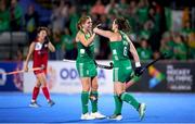 16 January 2024; Roisin Upton of Ireland, right, celebrates with teammate Katie Mullan after scoring her side's third goal during the FIH Women's Olympic Hockey Qualifying Tournament Pool A match between Ireland and Korea Republic at Campo de Hockey Hierba Tarongers in Valencia, Spain. Photo by Manuel Queimadelos/Sportsfile