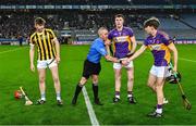 13 January 2024; Referee Colm McDonald with Tullogher Rosbercon captain Colman O'Sullivan and St Catherine's joint-captains Eoghan O'Riordan, 3, and Conor Hegarty before the AIB GAA Hurling All-Ireland Junior Club Championship final match between St Catherine's of Cork and Tullogher Rosbercon of Kilkenny at Croke Park in Dublin. Photo by Piaras Ó Mídheach/Sportsfile