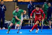 17 January 2024; Luke Madeley of Ireland in action against Kentaro Fukuda of Japan during the FIH Men's Olympic Hockey Qualifying Tournament Pool A match between Ireland and Japan at Campo de Hockey Hierba Tarongers in Valencia, Spain. Photo by Manuel Queimadelos/Sportsfile