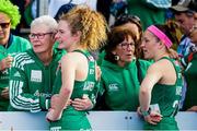 18 January 2024; Niamh Carey and Beth Barr of Ireland are consoled by their families after their side's defeat at the FIH Women's Olympic Hockey Qualifying Tournament semi-final match between Ireland and Spain at Campo de Hockey Hierba Tarongers in Valencia, Spain. Photo by Manuel Queimadelos/Sportsfile