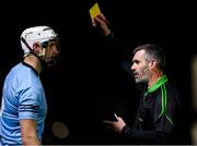 18 January 2024; Referee James Owens shows a yellow card to Ryan Mullaney of SETU Carlow during the Electric Ireland Higher Education GAA Fitzgibbon Cup Round 1 match between SETU Carlow and University of Galway at SETU Carlow Sport Complex in Carlow. Photo by Seb Daly/Sportsfile