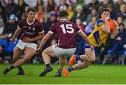 19 January 2024; Luke Glennon of Roscommon evades the tackle of Charlie Power of Galway, left, and Cillian Ó Curraoin during the Connacht FBD League final match between Roscommon and Galway at University of Galway Connacht GAA AirDome in Bekan, Mayo. Photo by Tyler Miller/Sportsfile